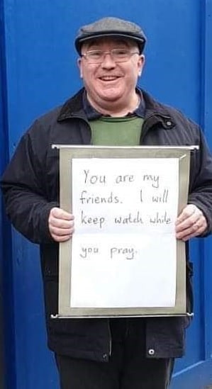 Andrew Graystone, a Christian, 57, from Manchester, stood out the Madina mosque on Friday after learning about the shooting at two mosques in Christchurch, New Zealand, which has left 50 dead.