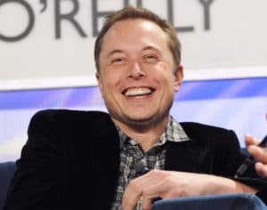 Tesla stock price reaches all time high of $1900 ahead of 5 for 1 stock split. it's no wonder Elon Musk has plenty to smile about.